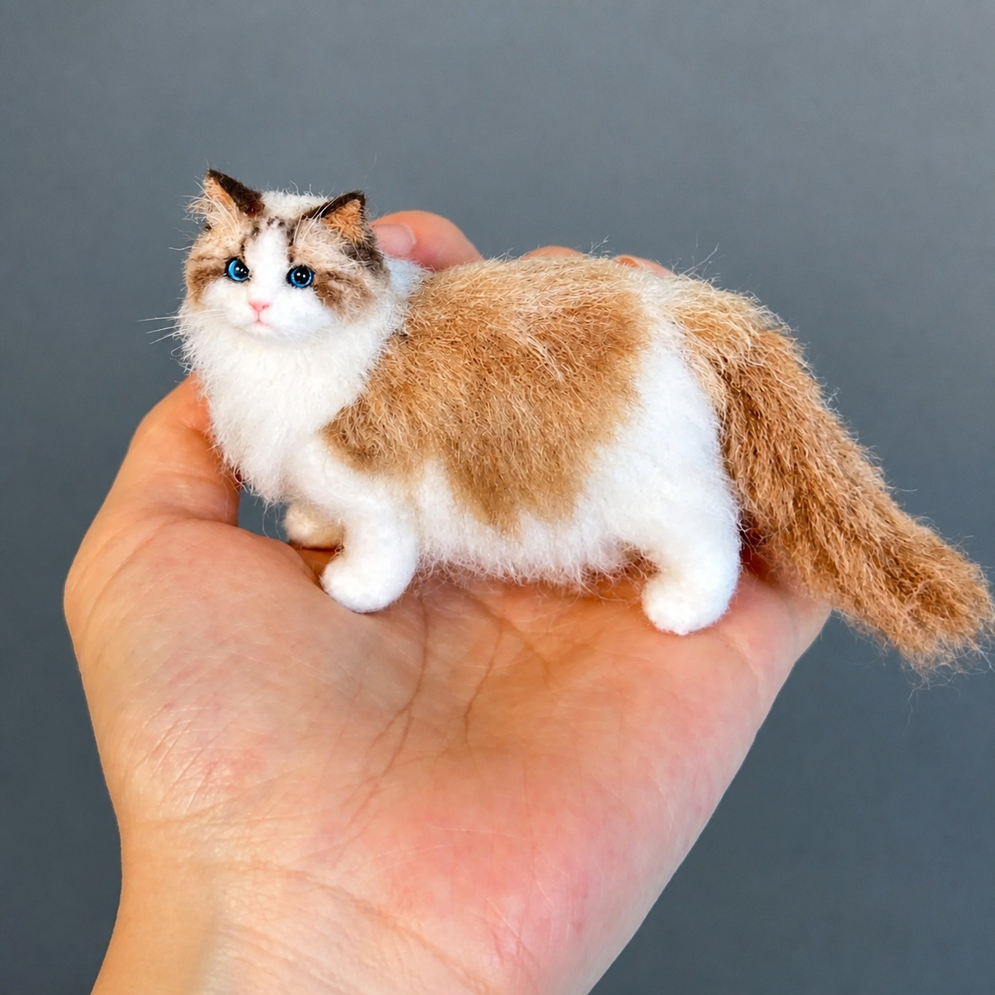 Handmade ragdoll cat mini full body wool felt figurine on a palm